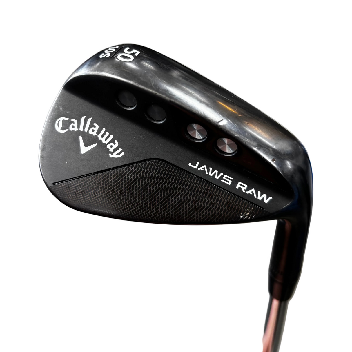 Golf club head with Callaway logo on a gray surface