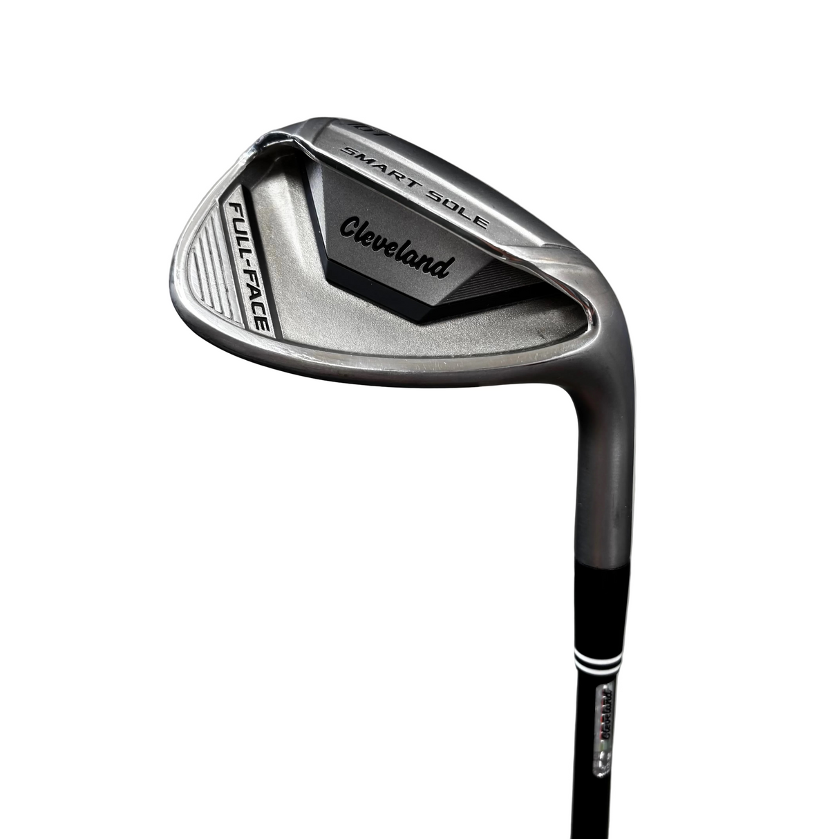 A Cleveland Cleveland Golf Smart Golf Full Face iron club head and part of the shaft, photographed on a gray concrete floor with a blue mat in the foreground.