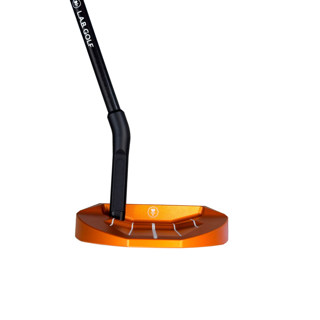 Orange golf club head with black shaft on a concrete floor