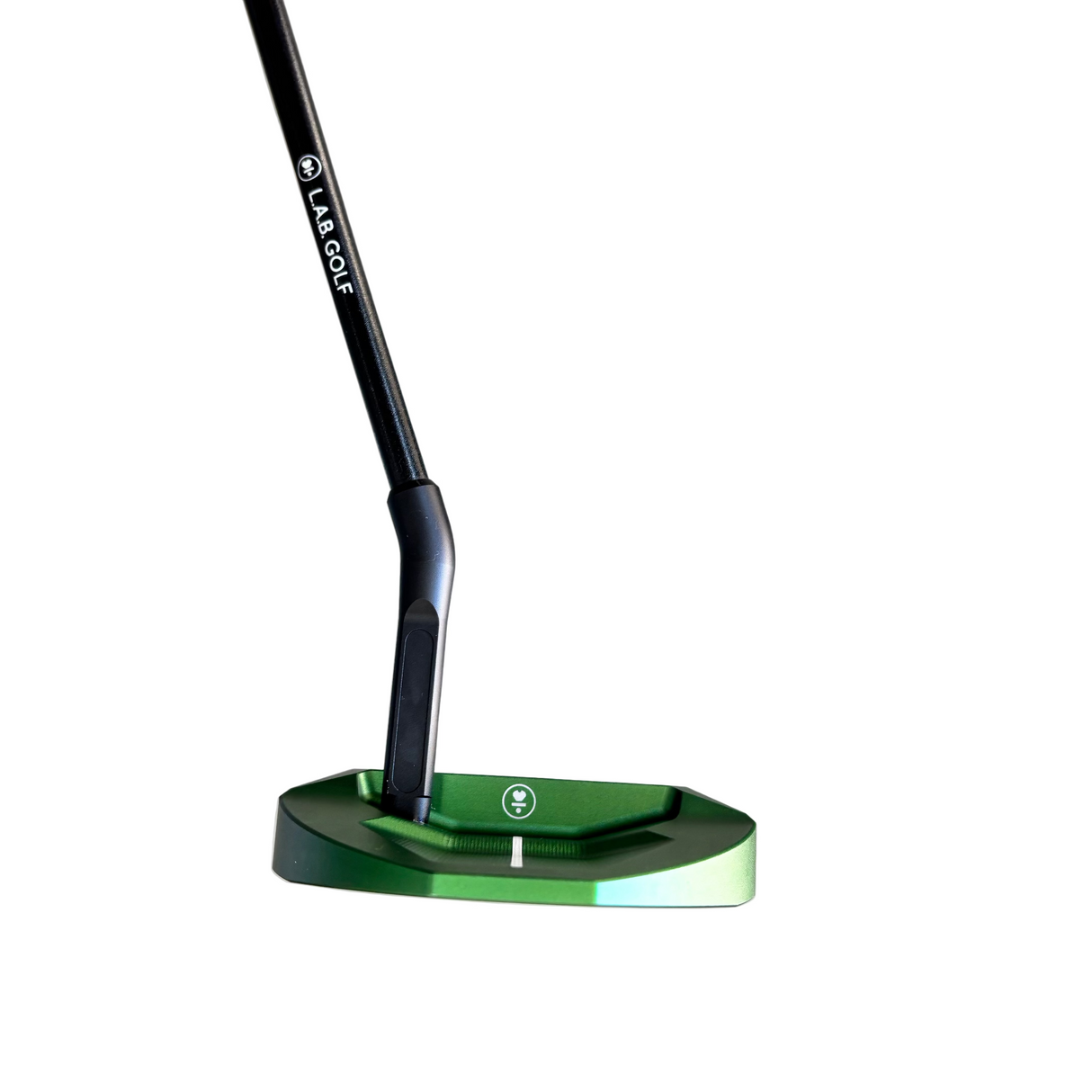 Close-up of a green golf putter head on a gray surface with a blurred background