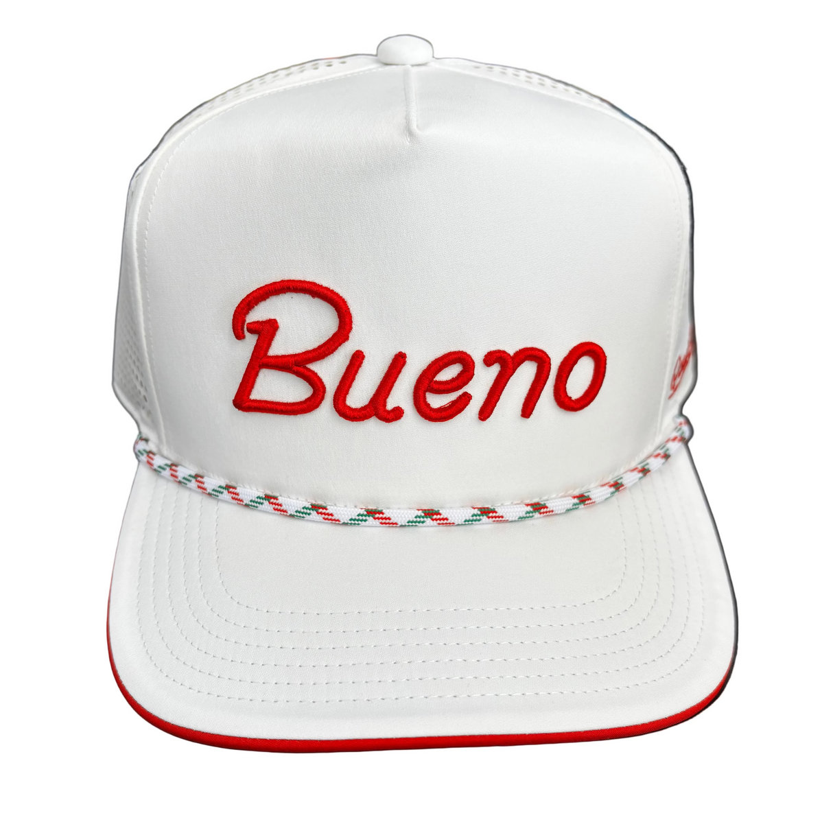 White cap with 'Bueno' in red on a dark surface