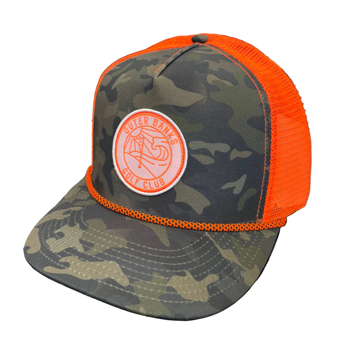 Camouflage cap with orange brim and logo on a black surface