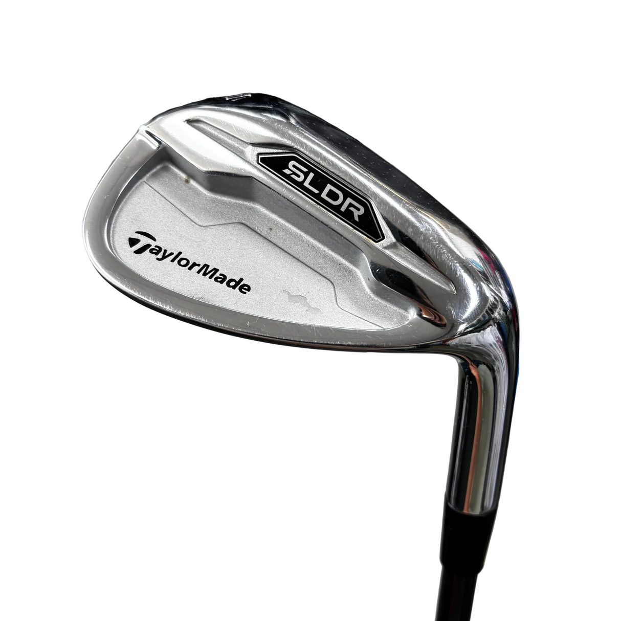 Golf club head with TaylorMade logo on a blurred background
