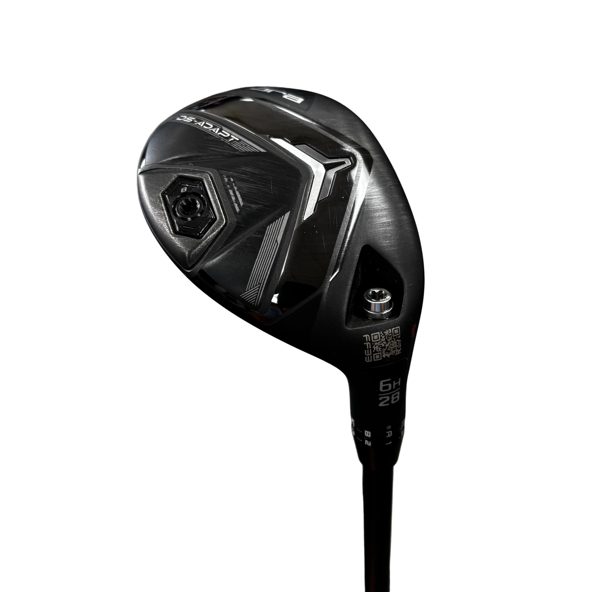 A black Callaway D2 Duster golf club head with white and silver accents, standing upright on a black shaft. The background shows a gray concrete floor with blurred golf club racks.