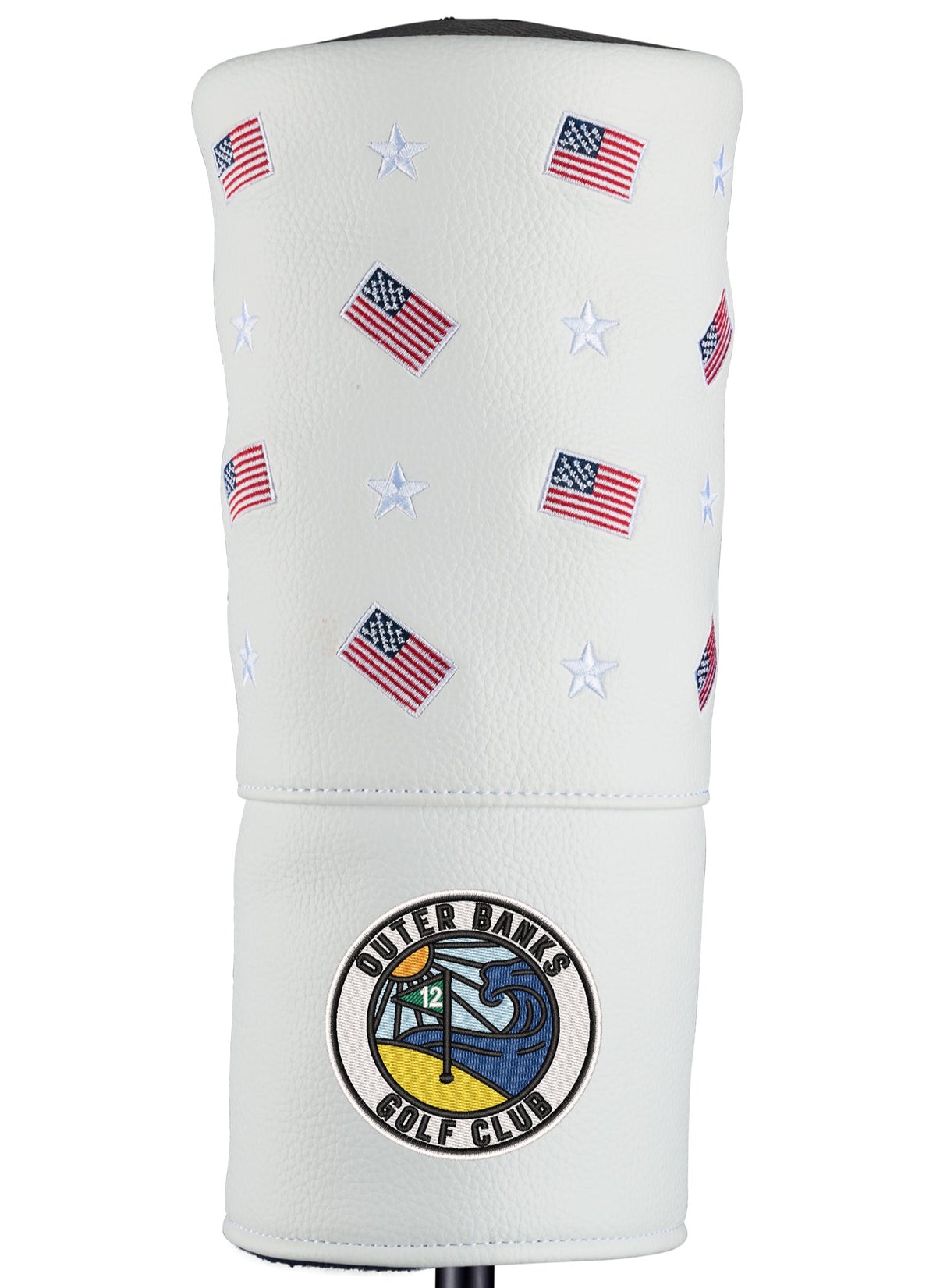 A white golf driver headcover with red and blue geometric patterns and American flags