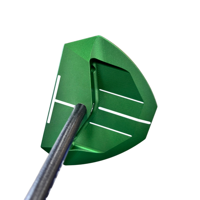 Close-up of a green golf putter head with a blurred background