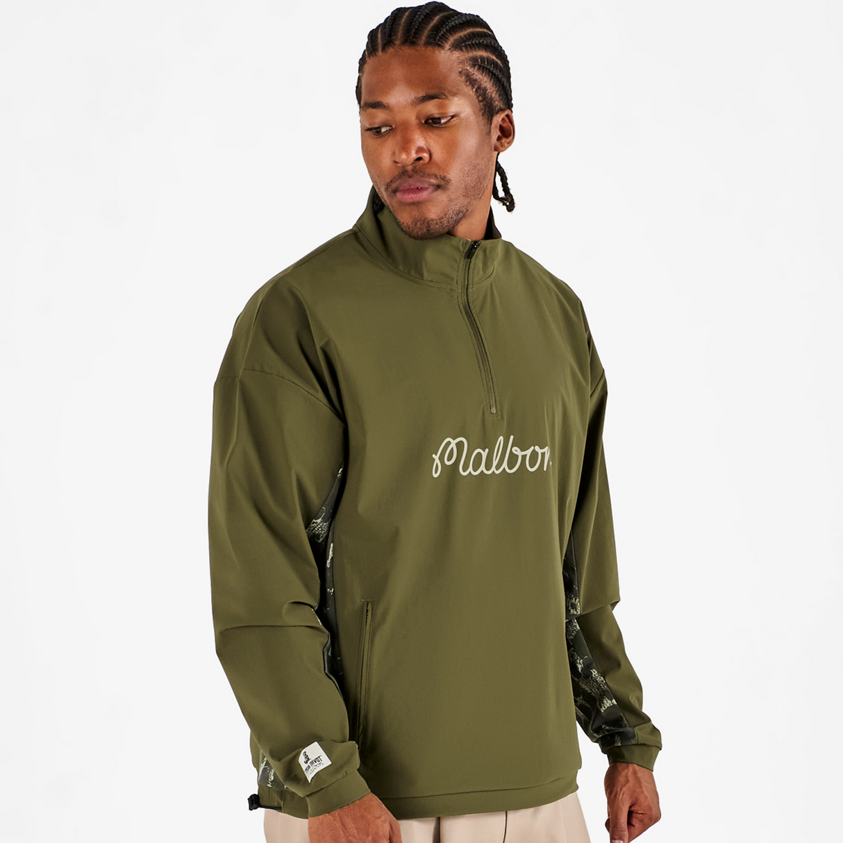 Man wearing a green pullover with 'Malbon' branding on a white background