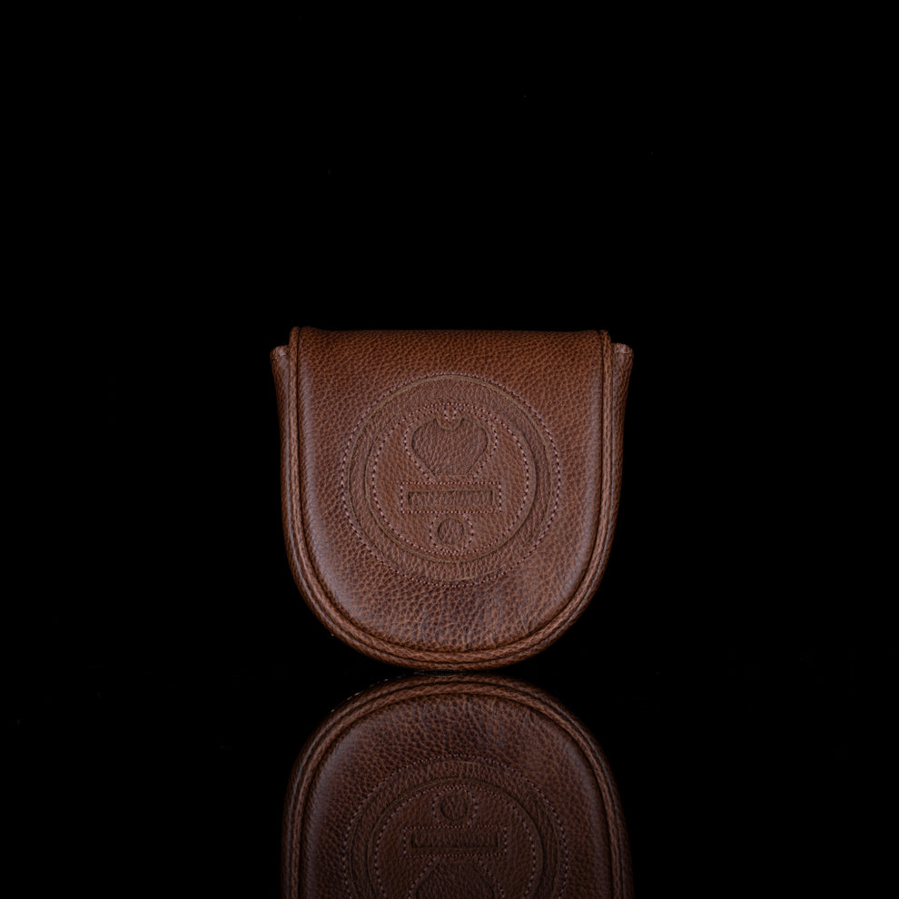 Brown leather pouch with a logo on a black background
