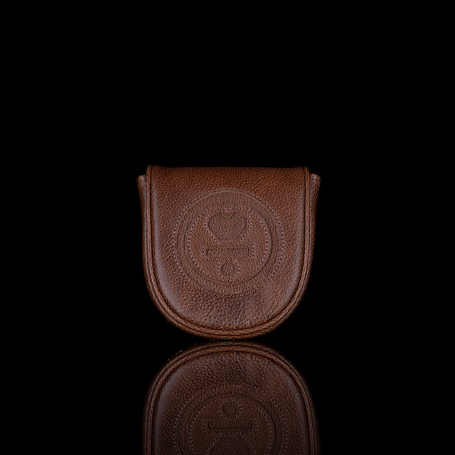 Brown leather pouch with a logo on a black background