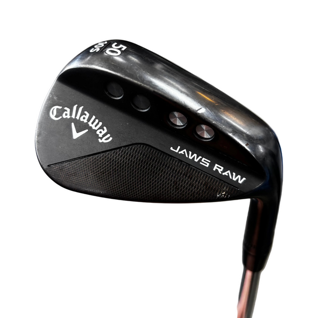 Golf club head with Callaway logo on a gray surface