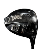 Close-up of a PXG 0811 XT  golf driver clubhead on a concrete floor, with PXG branding and model text clearly visible.