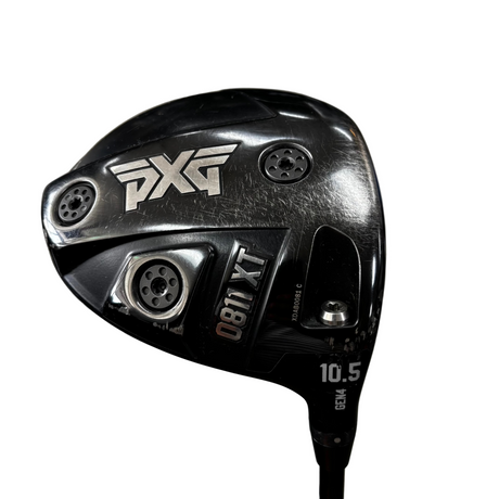 Close-up of a PXG 0811 XT  golf driver clubhead on a concrete floor, with PXG branding and model text clearly visible.