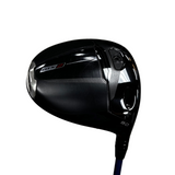 A close-up shot of a black Callaway golf driver head, model C15 3, on a blue shaft, photographed against a gray concrete floor background.
