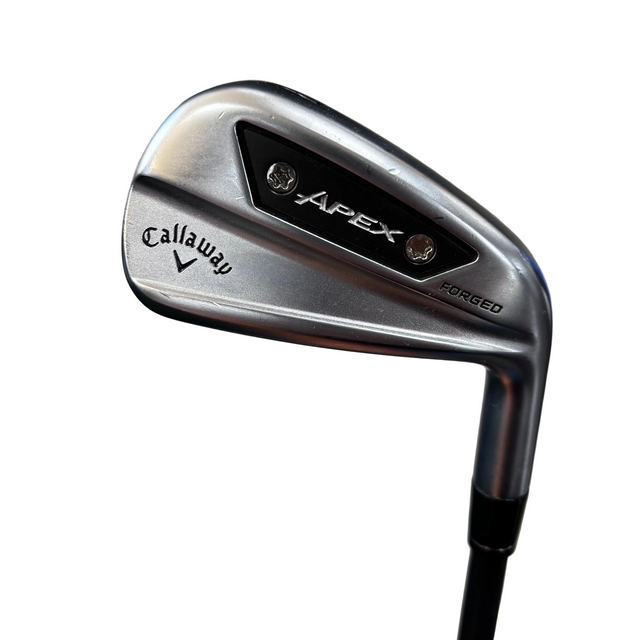 A Callaway Apex forged iron golf club head shown close-up, with the Callaway logo and Apex branding visible on the metallic clubface.