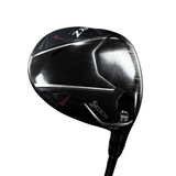 Close-up of a black Srixon Z-X golf club head with silver and red detailing, resting on a gray concrete surface.