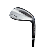A Cleveland RTZ Z-Boost golf iron club head and part of the black shaft, photographed on a gray concrete floor.