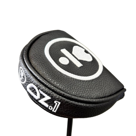 Black golf club head cover with white logo and text on a blurred background