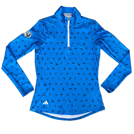 Blue long-sleeve athletic shirt with black pattern on a gray surface