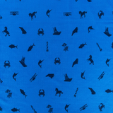Blue fabric with black animal and object silhouettes