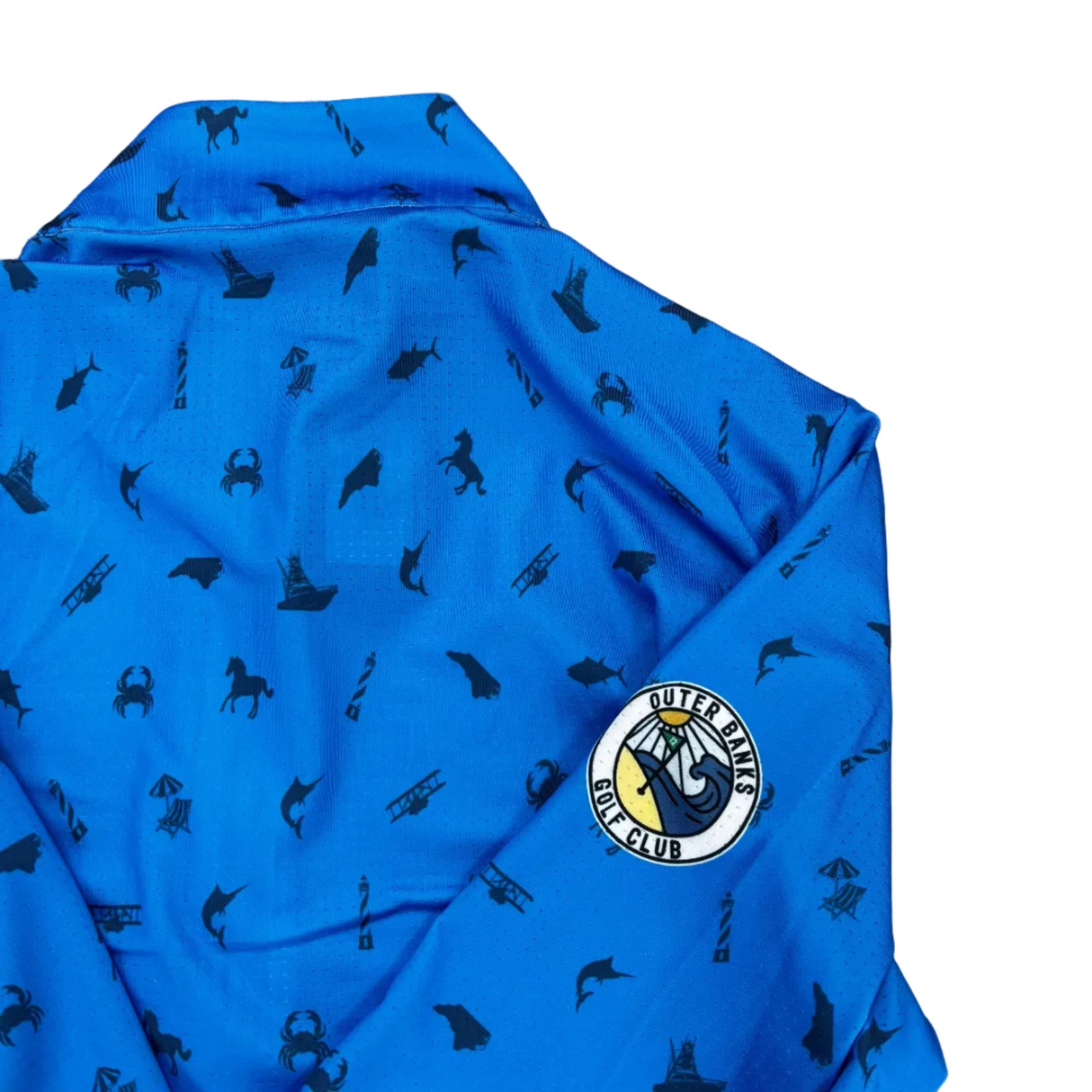 Blue fabric with black patterns and a logo on a gray concrete surface