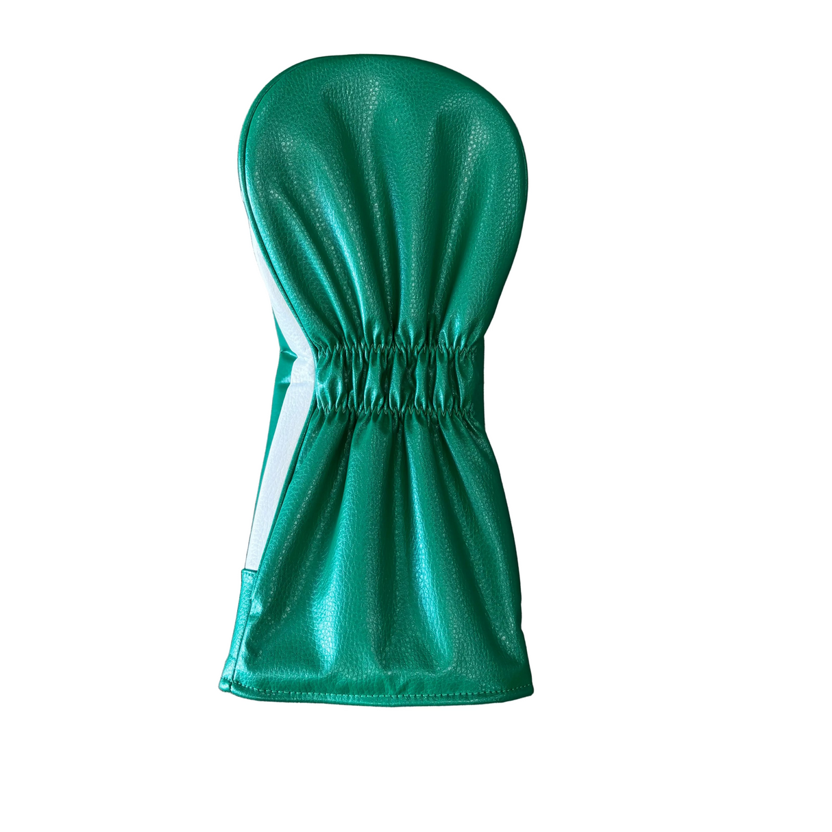 Green driver headcover on a gray concrete surface