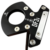 Golf putter with 'DF3i' branding held by a hand on a metallic surface