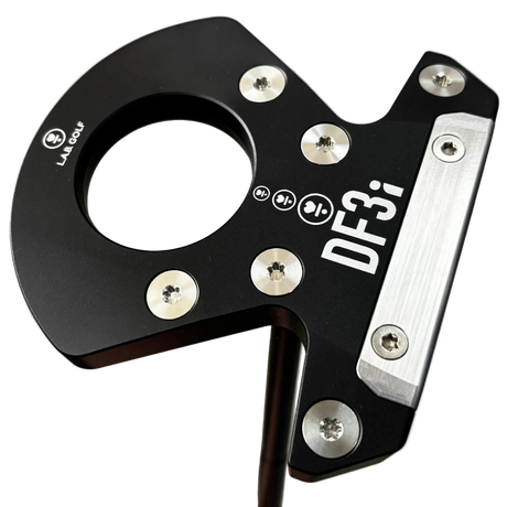 Golf putter with 'DF3i' branding held by a hand on a metallic surface
