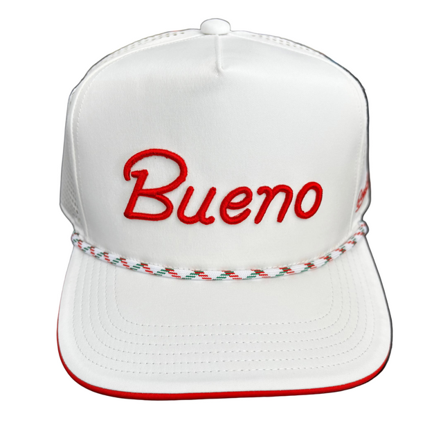 White cap with 'Bueno' in red on a dark surface