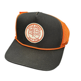 Black and orange cap with a logo on a white background