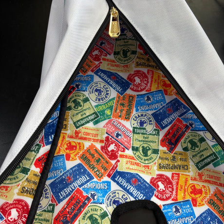 Close-up of a bag with colorful brand logos on a white background