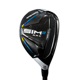 Golf club head with 'SIM MAX' branding on a blurred background