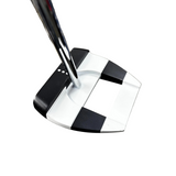 Golf putter with a black and white head on a blurred background