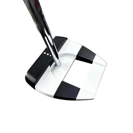 Golf putter with a black and white head on a blurred background