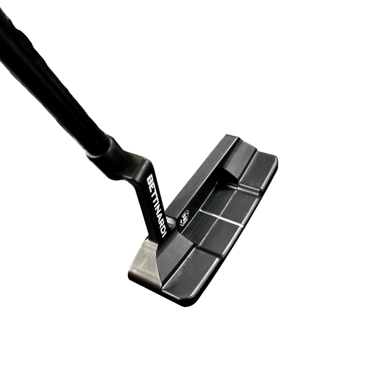 Close-up of a golf putter with a blue glove in the background