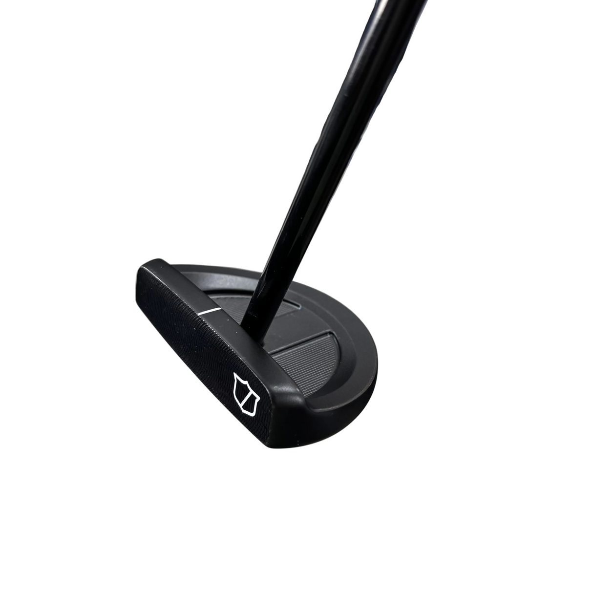 Black golf putter on a concrete floor with a blue glove in the background