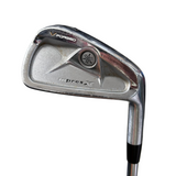 Golf club head with 'V Forged' and 'impress X' branding on a blurred background