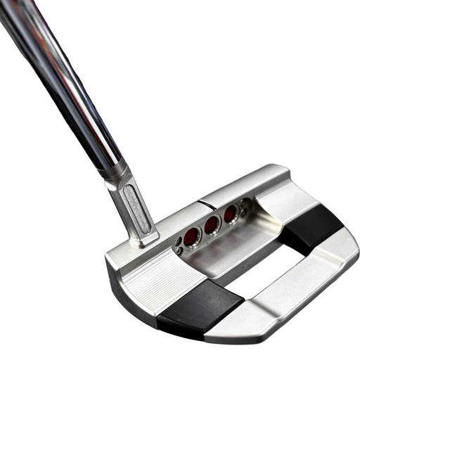 Close-up of a golf putter with a blurred background