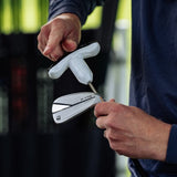 Person holding a golf club with a close-up of the head