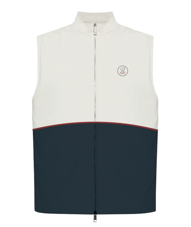 A sleeveless zip-front vest with a color-block design, featuring an off-white upper section, a dark navy lower section, and a thin red stripe separating the two sections. It has a small circular embroidered logo on the left chest.