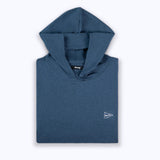 Folded blue hoodie with a small logo on a white background